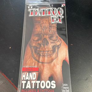 Tattoos: SKull hand Tattoos